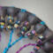 multicolor glass chip beads adorn blue and purple twisted wire branches with dominant gold tones